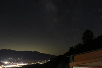a starry night with a view of a city at Epic View Hot tub National forest in Wofford Heights