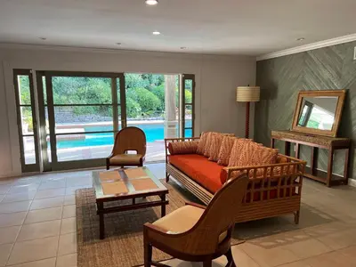 a living room with a couch and a table at Porter Paradise in Deer Lake Highlands