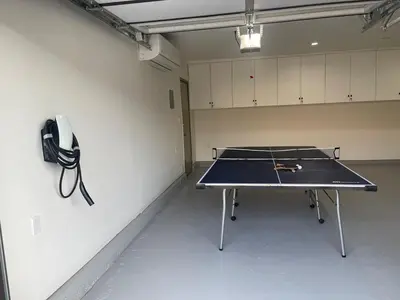 a ping pong table in a room with a ping pong racket at Porter Paradise in Deer Lake Highlands