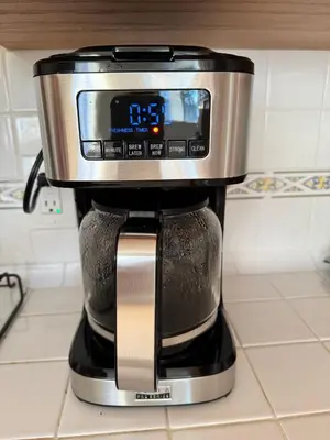 a coffee pot on top of a coffee machine at gateway to the ocean in Hawthorne