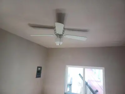 a ceiling fan in a room with a window at 2bd Home Lomita California spectacular location in Lomita