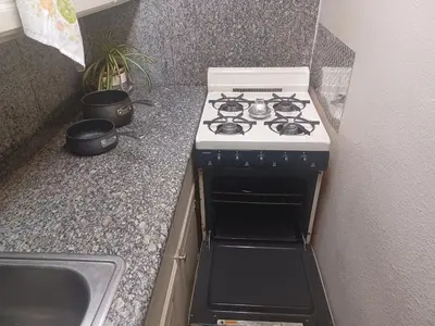 a white stove in a kitchen with a sink at 2bd Home Lomita California spectacular location in Lomita