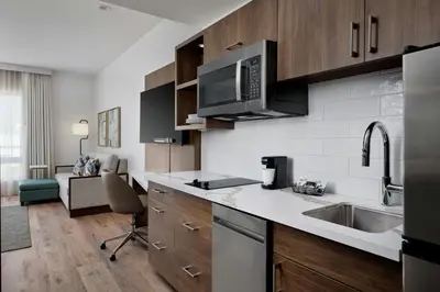 a kitchen with a sink and a microwave at TownePlace Suites by Marriott Ventura Oxnard in Oxnard
