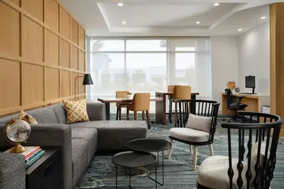 a living room with a couch and chairs and a table at TownePlace Suites by Marriott Ventura Oxnard in Oxnard