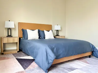 a large blue bed with two night stands and two lamps at Modern Top Floor 3BD 3BA Condo Marina del Rey in Los Angeles