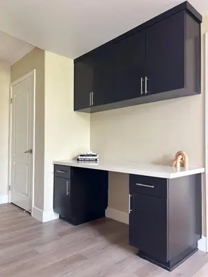 a kitchen with black cabinets and a white counter at Modern Top Floor 3BD 3BA Condo Marina del Rey in Los Angeles
