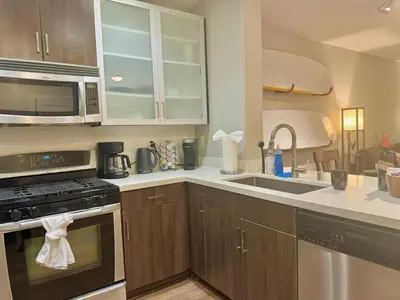 a kitchen with a sink and a stove top oven at Surfs up! Cozy 1 Bedroom Condo with Fountain View in Los Angeles