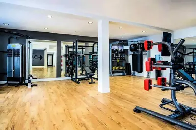 a gym with several treadmills and weights at Modern Venice Beach Stay - Walk to Marina & Boardwalk in Los Angeles