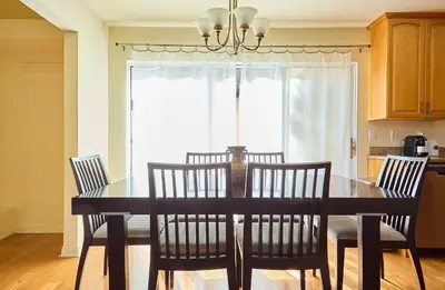 a dining room with a black table and chairs at Malibu Home in Enchanting Hills 5 min from the beach in Malibu