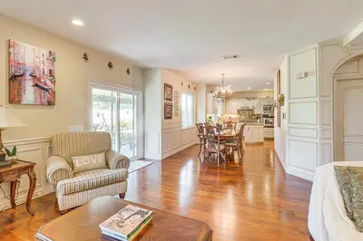 a living room with a table and a dining room at 6 Mi to Dtwn Pasadena Home with Patio and Yard! in San Gabriel