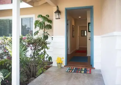 an open door to a home with plants at MagicwayVillas Paradise Pier Home - Across Disney in Anaheim