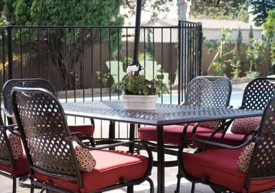 a table and chairs with a potted plant on a patio at MagicwayVillas Paradise Pier Home - Across Disney in Anaheim
