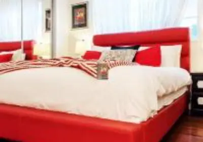a bed with a red headboard in a bedroom at MagicwayVillas Cars Theme Pool House - Pool&Spa in Anaheim