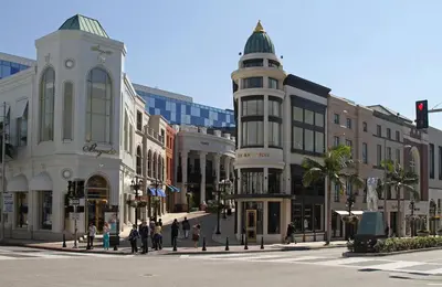 a busy city street with buildings and people crossing the street at Bright & Spacious in Iconic LA Neighborhood Free parking - 10mins to Cedars in Los Angeles