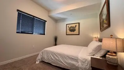 a bedroom with a white bed and a window at Private Room and Bathroom in Los Angeles