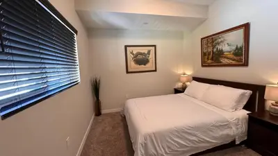 a bedroom with a white bed and a window at Private Room and Bathroom in Los Angeles