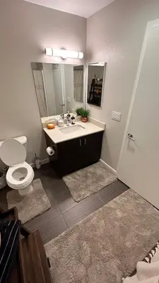 a bathroom with a sink and a toilet and a mirror at Private Room and Bathroom in Los Angeles