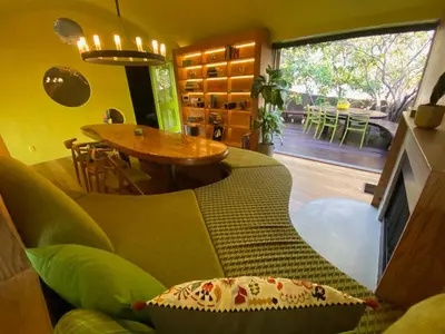 a living room with a couch and a table at The Bernardi House in Los Angeles