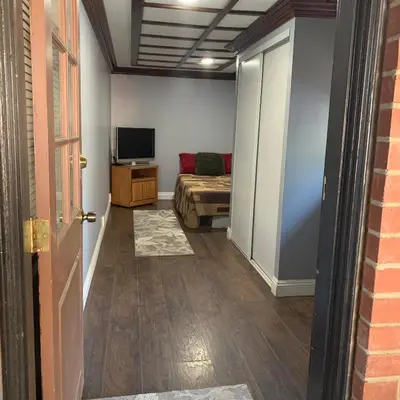 a room with a bed and a television in it at Cozy Room in Bakersfield