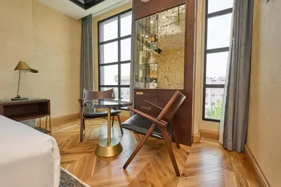 a room with a desk and a table and chairs at Whisky Hotel in Los Angeles