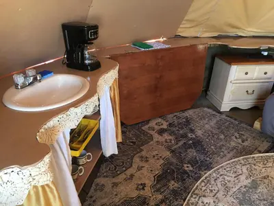 a bathroom with a sink and a counter top at Big Glamping Teepee in Bodfish