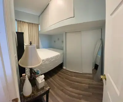 a bedroom with a bed and a lamp on a table at Private Sanctuary in Montebello in Montebello