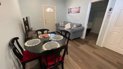 a living room with a table and a couch at Private Sanctuary in Montebello in Montebello
