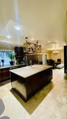 a kitchen with a sink and a living room at Private Room View Gated 2Acre Estate - Female Share Indoor - Men Share Outdoor - BB in Engine Company Number 109 Heliport
