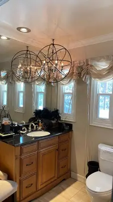 a bathroom with a sink and a chandelier at Private Room View Gated 2Acre Estate - Female Share Indoor - Men Share Outdoor - BB in Engine Company Number 109 Heliport