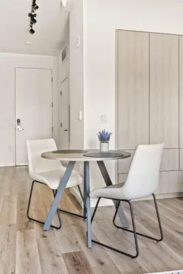 a dining room with a table and two chairs at Modern Hollywood Studio, Pool Parking Gym in Los Angeles