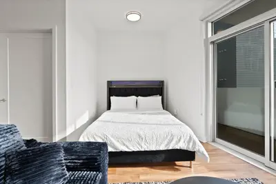 a bedroom with a bed and a window at Mid-Wilshire Studio Free Parking, Pool, Gym in Los Angeles
