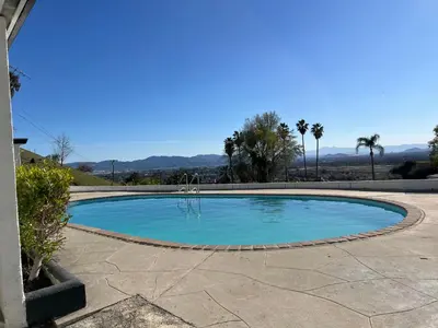 a small pool with blue water in a patio at Private Hillside Home with View - Yaamava - NOS in San Bernardino