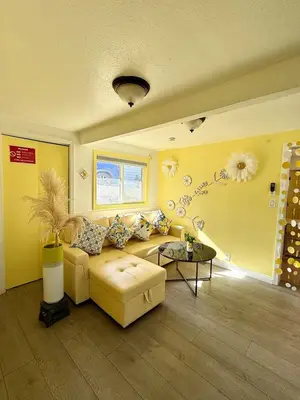 a living room with a couch and a table at Lemon Studio with Mountain view in Rosemead