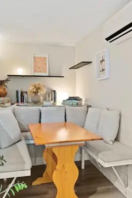 a dining room with a wooden table and chairs at Designer Laurel Canyon Retreat, Hollywood Hills in Los Angeles