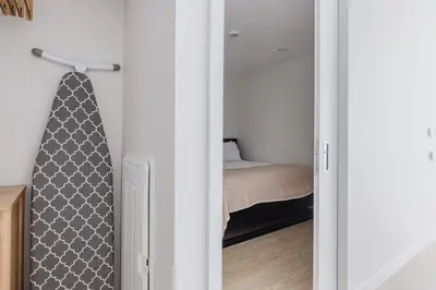 a bedroom with a door leading to a bed at Blueground Downtown elevator nr parks LAX-1240 in Los Angeles