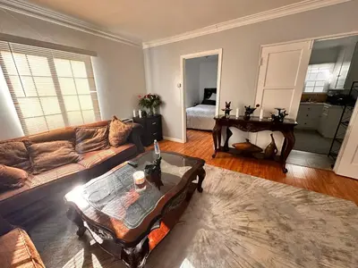 a living room with a couch and a table at Del in Los Angeles