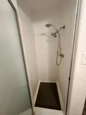 a shower with a glass door in a bathroom at Del in Los Angeles