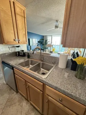a kitchen with a sink and a counter top at Oceanfront 1 BR Oasis w Parking & Pool 107 in Redondo Beach