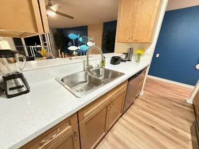 a kitchen with a sink and a counter top at Oceanfront 1 BR Oasis w Parking & Pool 417 in Redondo Beach