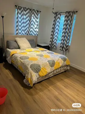a bedroom with a bed with a quilt on it at Luxury suite private entrance in Hacienda Heights