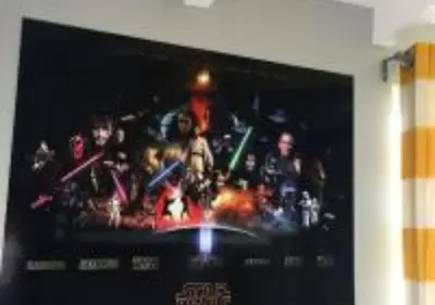 a television with a picture of a group of people at MagicwayVillas Star Wars House - Walking Distance to Disneyland in Anaheim