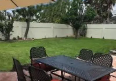 a black table and chairs in a yard at MagicwayVillas Star Wars House - Walking Distance to Disneyland in Anaheim