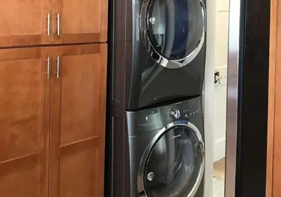 a microwave and a washer and dryer in a kitchen at MagicwayVillas Star Wars House - Walking Distance to Disneyland in Anaheim