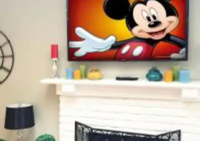a picture of a mickey mouse on top of a fireplace at MagicwayVillas TeaCup Pool House - Walking Distance to Disneyland in Anaheim