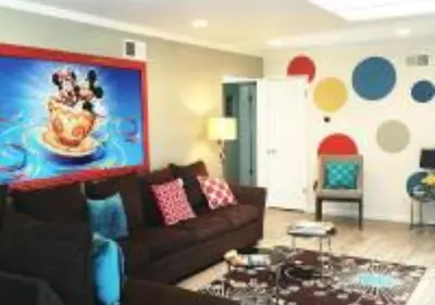 a living room with a couch and a table at MagicwayVillas TeaCup Pool House - Walking Distance to Disneyland in Anaheim