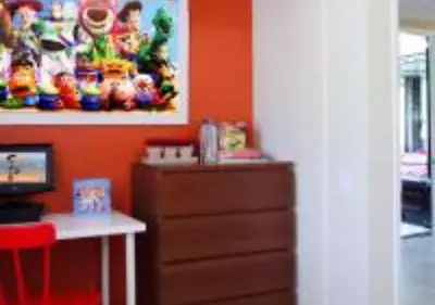 a room with a dresser and a painting on the wall at MagicwayVillas Micky's Fireworks Pool & Spa - Across Disneyland in Anaheim