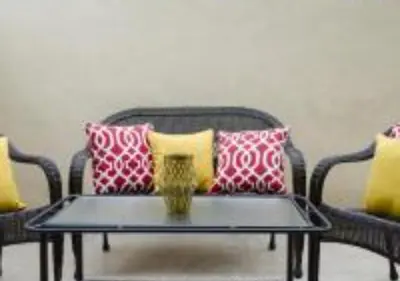 a coffee table with pillows on top of a chair at MagicwayVillas Micky's Fireworks Pool & Spa - Across Disneyland in Anaheim