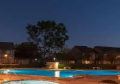 a swimming pool at night with a tree in the background at MagicwayVillas Micky's Fireworks Pool & Spa - Across Disneyland in Anaheim