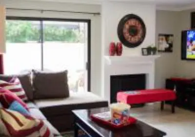 a living room with a couch and a fireplace at MagicwayVillas Micky's Fireworks Pool & Spa - Across Disneyland in Anaheim