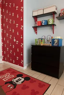 a room with a black dresser and a red rug at Magicwayvillas Micky's Playground Pool & Spa - Walking TO Disney in Anaheim
